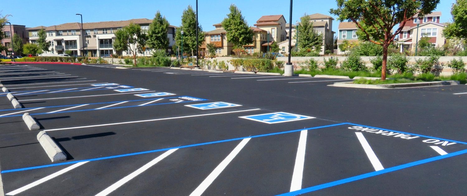 Freshly Resurfaced And Repainted Handicap Parking Space In A Parking Lot