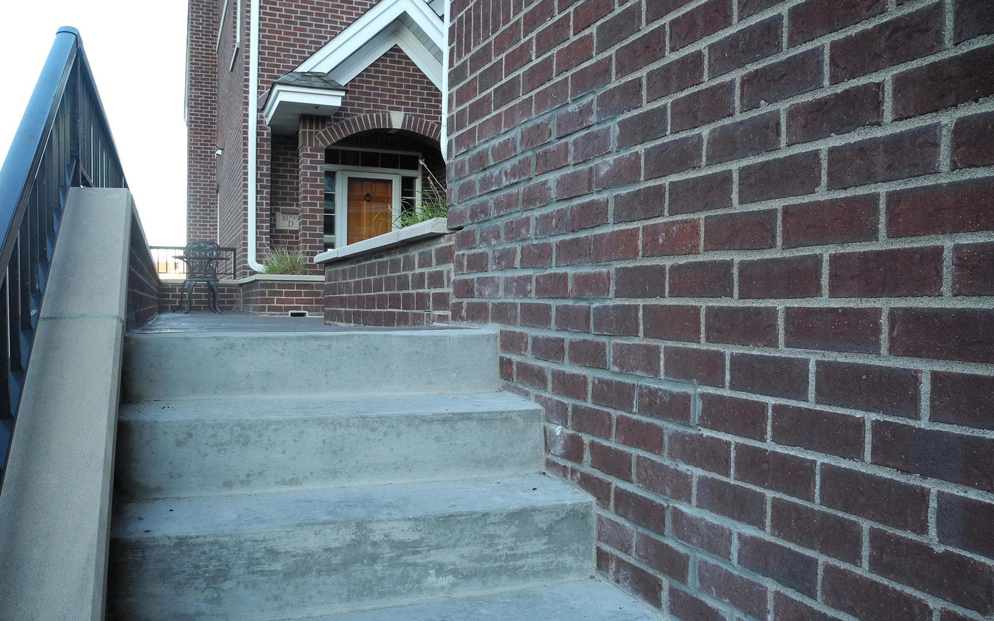 Front View Of Front Door And Concrete Stairs in Woodbury, Minnesota