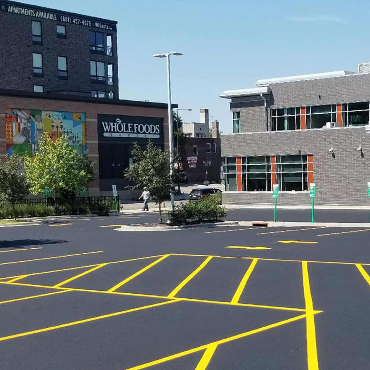 Square Side View Of Plaza Parking Lot And Stores in Plymouth, Minnesota